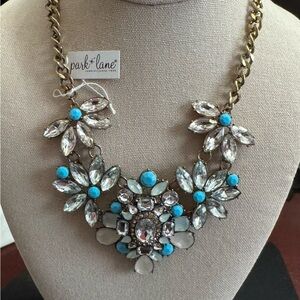 Park Lane Gold Necklace with Turquoise and Clear Floral Design